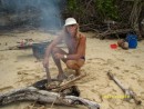Claude grilling freshly caught fish on the beach